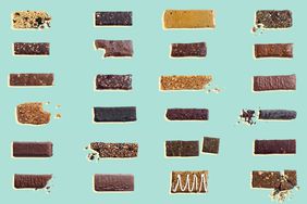 Large Assortment of Granola Bars on White Background; Some Crumbled and Bitten