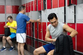 Men getting ready to workout at the gym in the locker room - Lifestyles