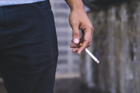 Man holding a cigarette