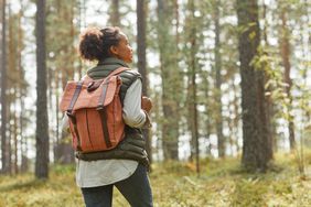 Young woman hiking with a backpack