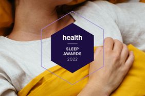 Health Sleep Awards 2022 Badge with a woman in bed sleeping in the background. 