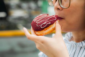 woman eating doughnut