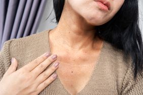 A close-up of a woman's neck and upper chest