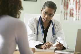 Female Doctor Talking to Patient