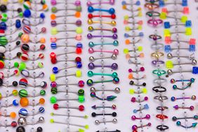 Close up of colorful piercings