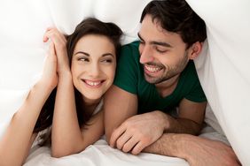 Happy couple in bed