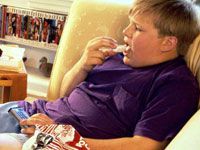 obese-boy-sitting-tv-200.jpg