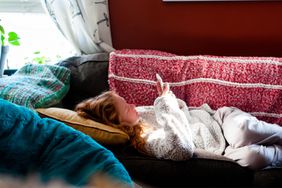 Teen child alone on couch doing text therapy