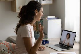 Woman is video chatting with her online therapist