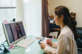 A patient is talking with a mental health professional with online therapy