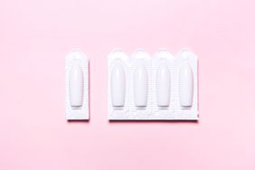 vaginal suppository on a pink background, for the treatment of candidiasis