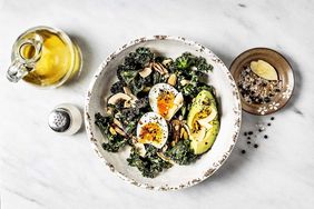 Vegetarian Meal Bowl of kale salad with boiled eggs and avocado