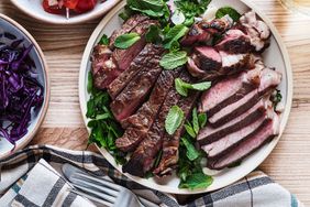 Fresh roast beef meat steak on plate with salad 