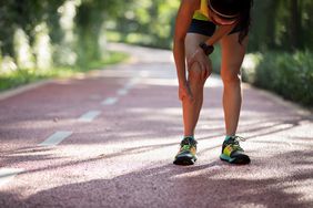 A female runner touching her shin splint