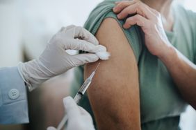 close-up of person getting vaccine in arm